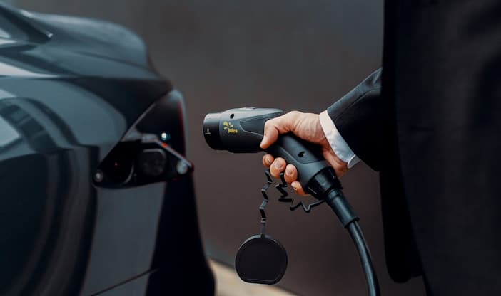 An electric vehicle being charged